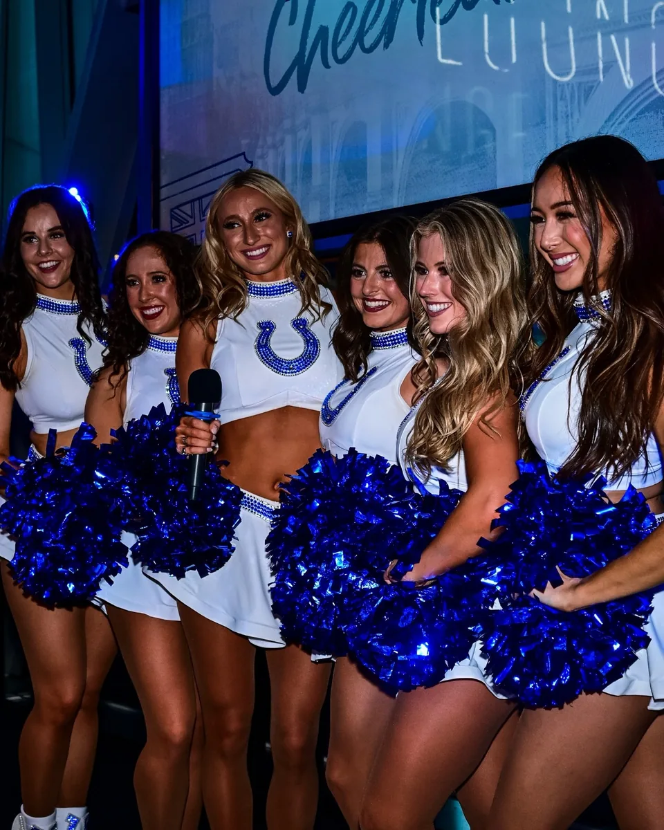 Colts Cheerleaders and a guest posing for a photograph at Greenwood