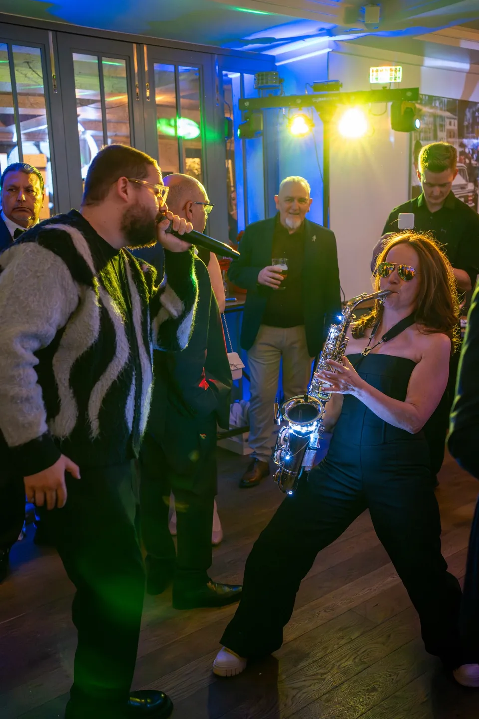 Live saxophonist joining guests on the dance floor at The Italian Greyhound