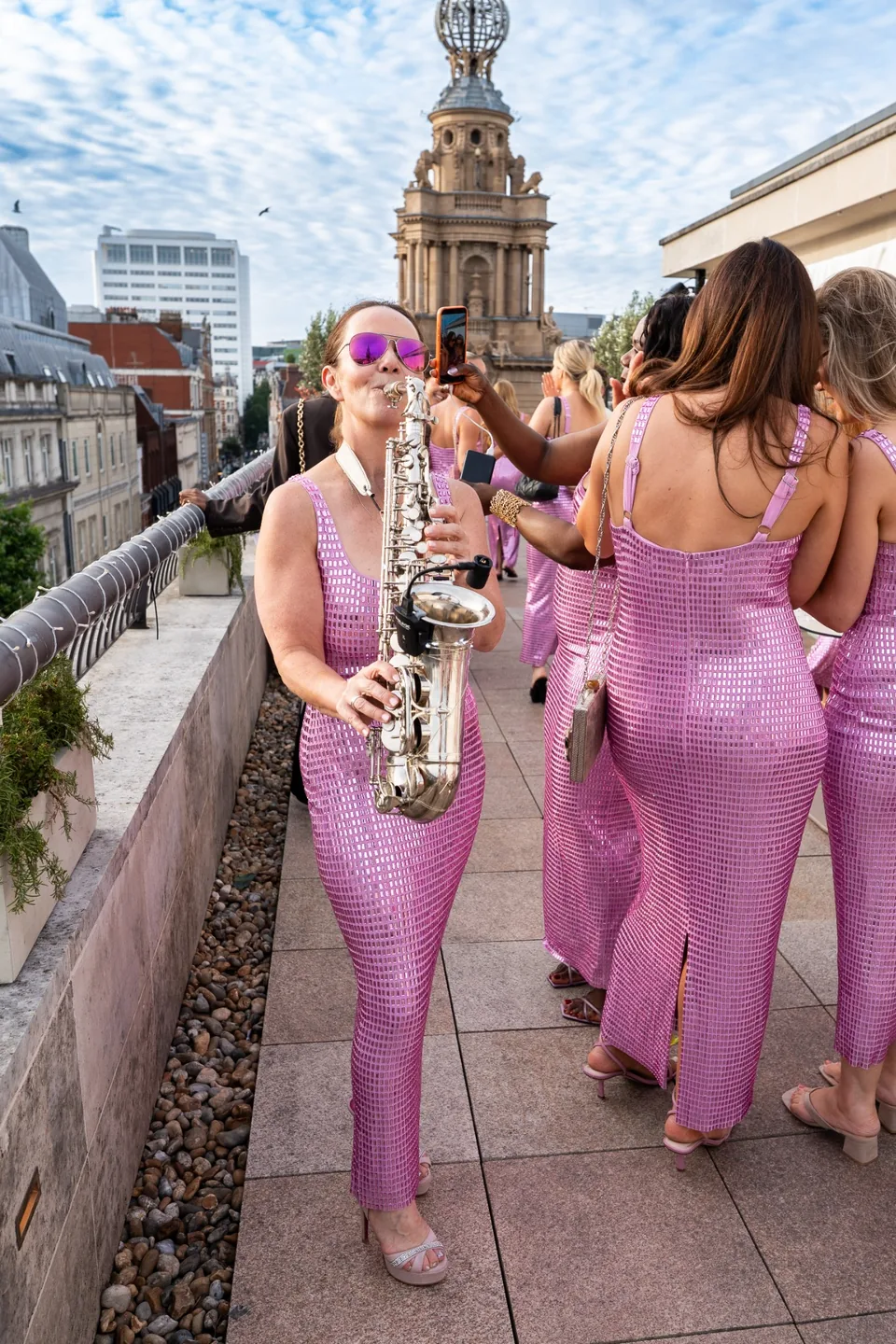 Live sax among guests at the Karen Millen and Whitley Neill rooftop launch in London