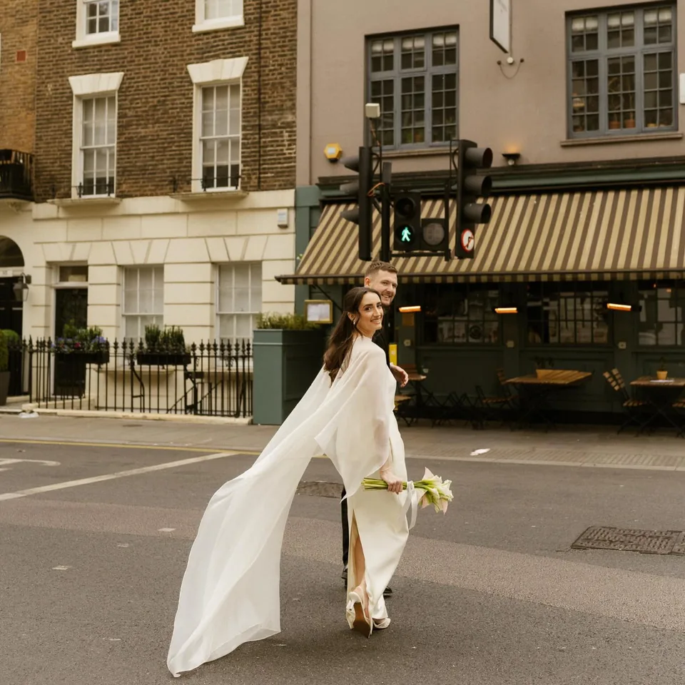 Newly married couple outside The Italian Greyhound in London