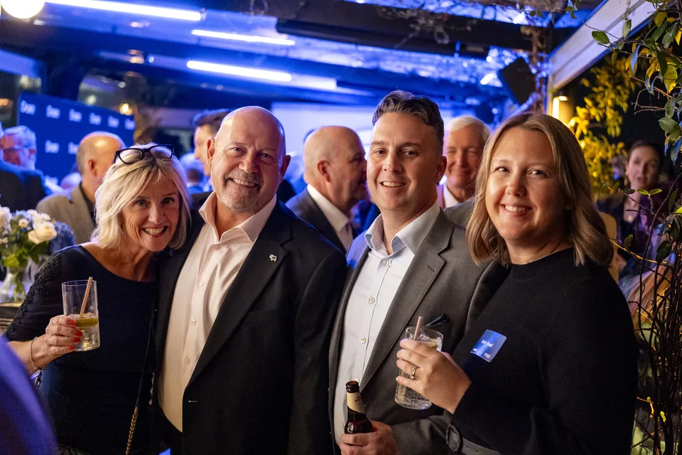 Four guests smiling together at the Wagtail corporate event