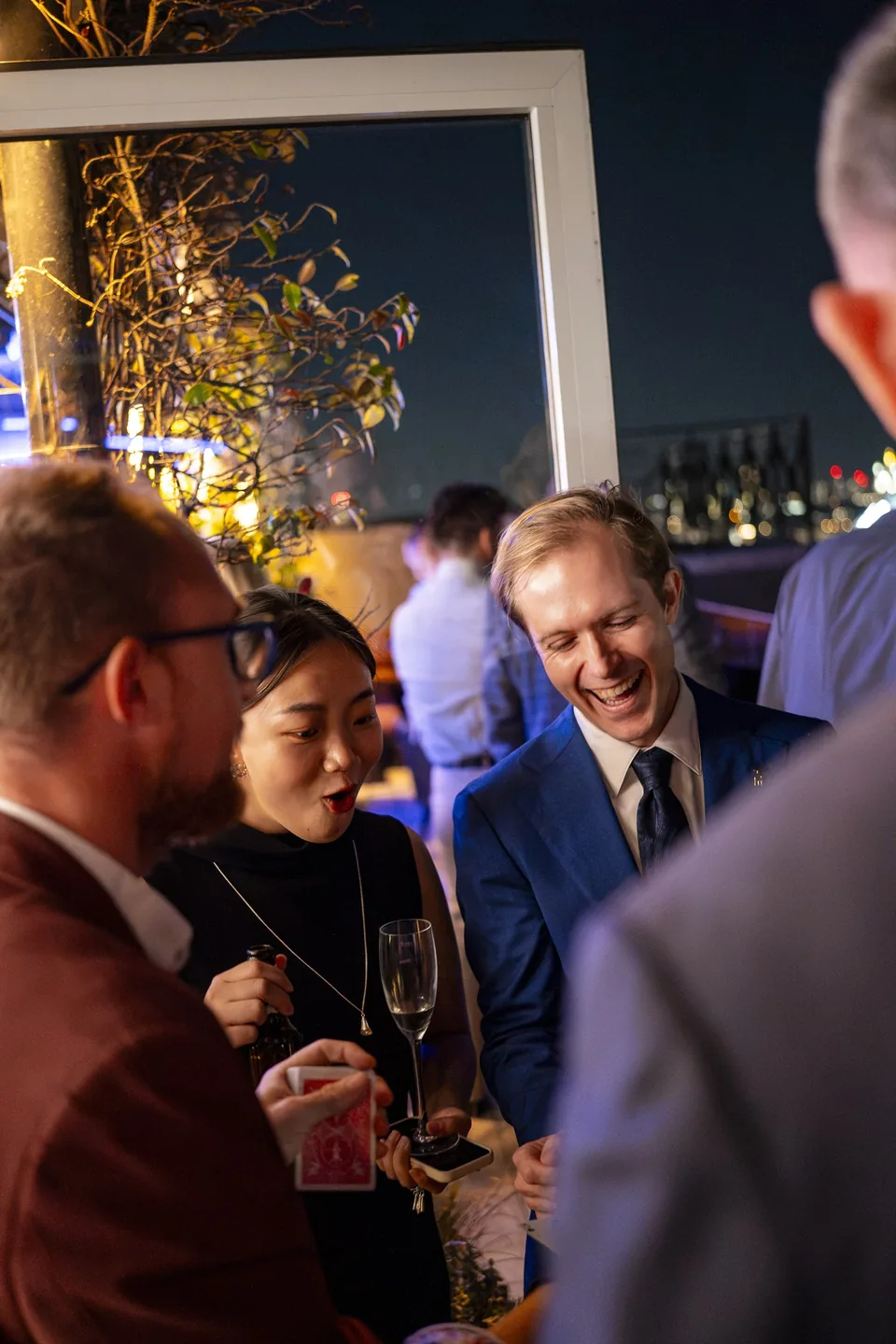 Guests watching close-up card magic at the Wagtail corporate event